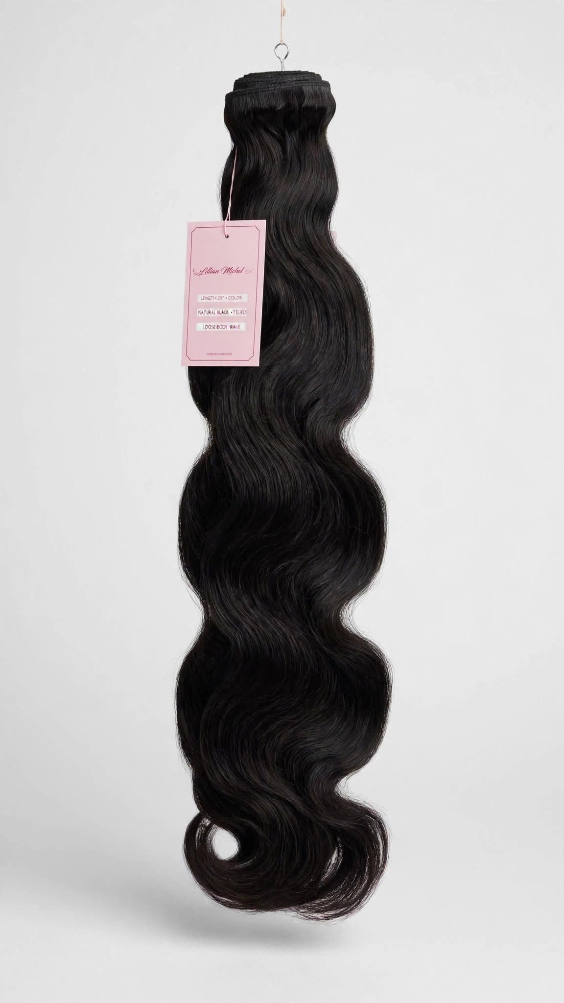 Raw body wave human hair bundle with Lillian Michel Co. tag