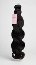 Raw body wave human hair bundle with Lillian Michel Co. tag