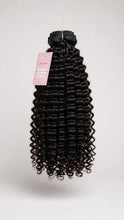 Raw curly human hair bundle with Lillian Michel Co. tag