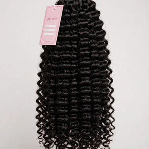 Raw curly human hair bundle with Lillian Michel Co. tag