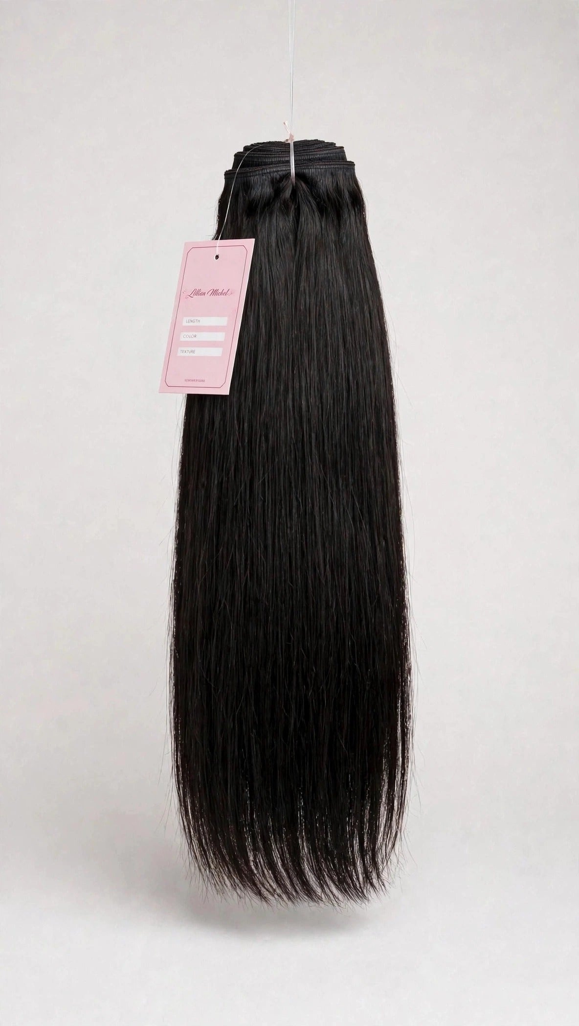 Raw straight human hair bundle with Lillian Michel Co. tag