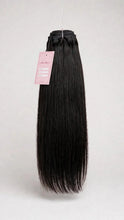 Raw straight human hair bundle with Lillian Michel Co. tag